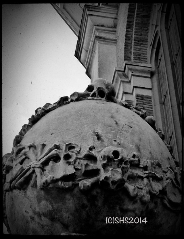 back and white photography by susan sheldon nolen of skull in front of church